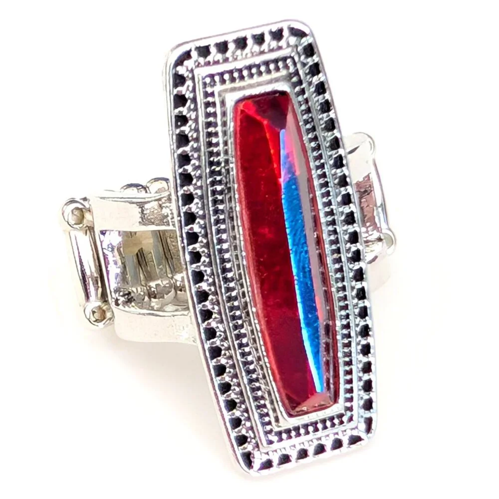 Orangey red glass ring with center bright blue stripe stretch ring